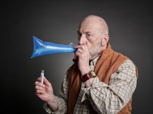 man performing breath test to diagnose SIBO (small intestinal bacterial overgrowth)