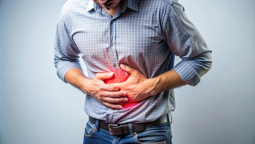 Woman with stomach pain seeking abdominal pain treatment in Los Angeles